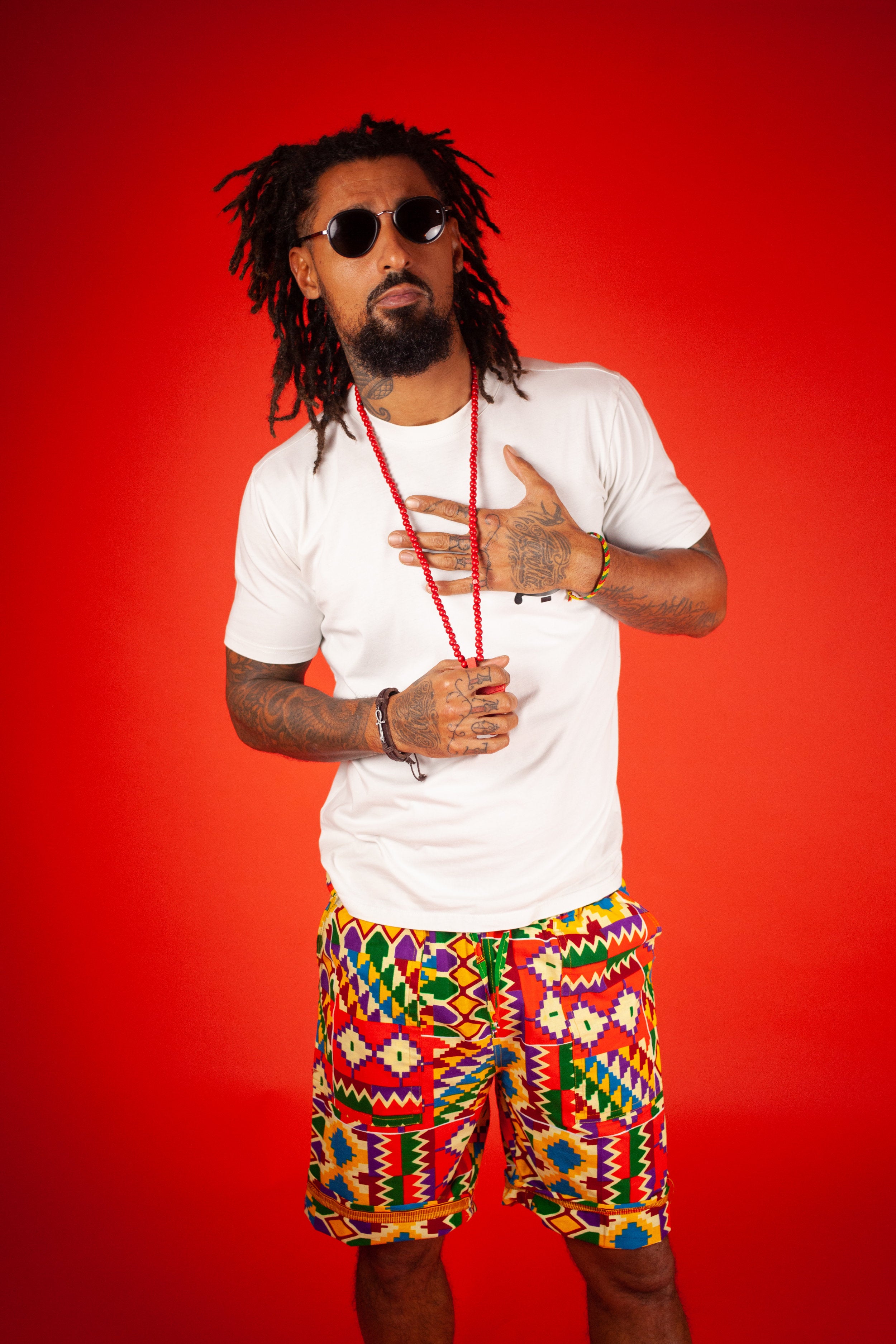 African Shorts in Electric Orange Kente - Continent Clothing
