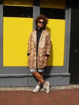 Escudo del Festival en Oro Impresión Africana