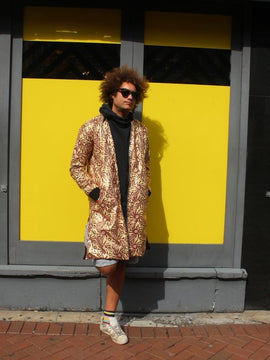 Escudo del Festival en Oro Impresión Africana